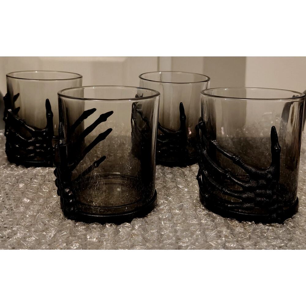 HALLOWEEN!  Four 3D smoked glass & metal skeleton hand whiskey tumblers.